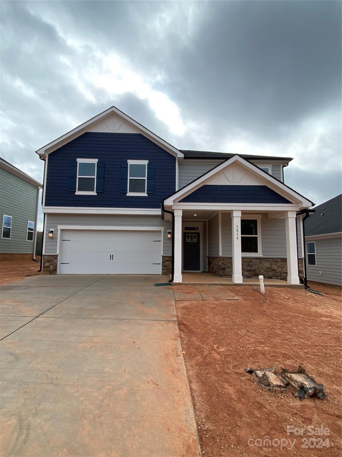 a front view of a house with yard