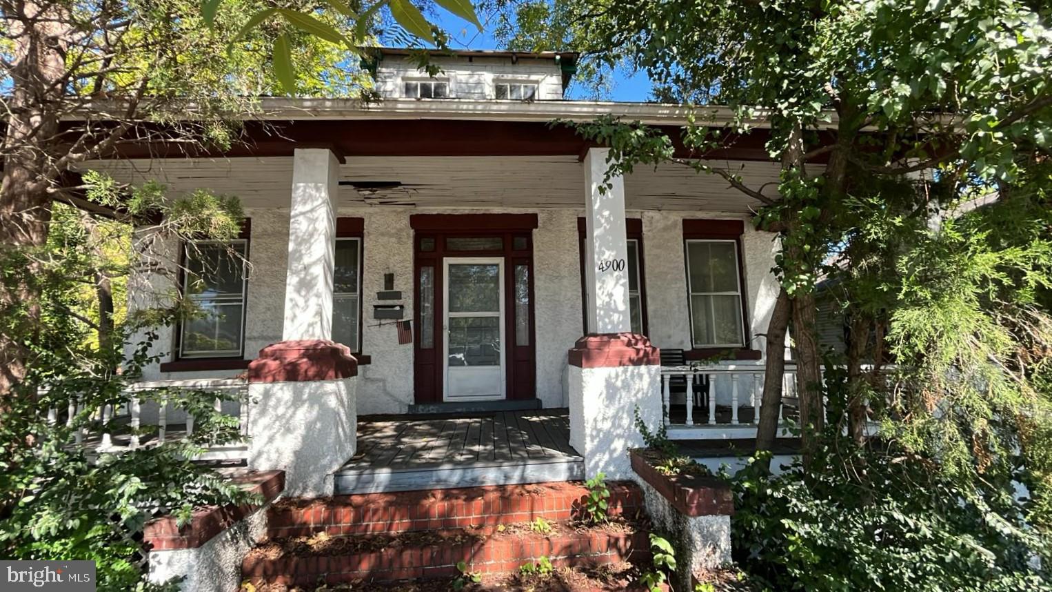 a front view of a house with a porch