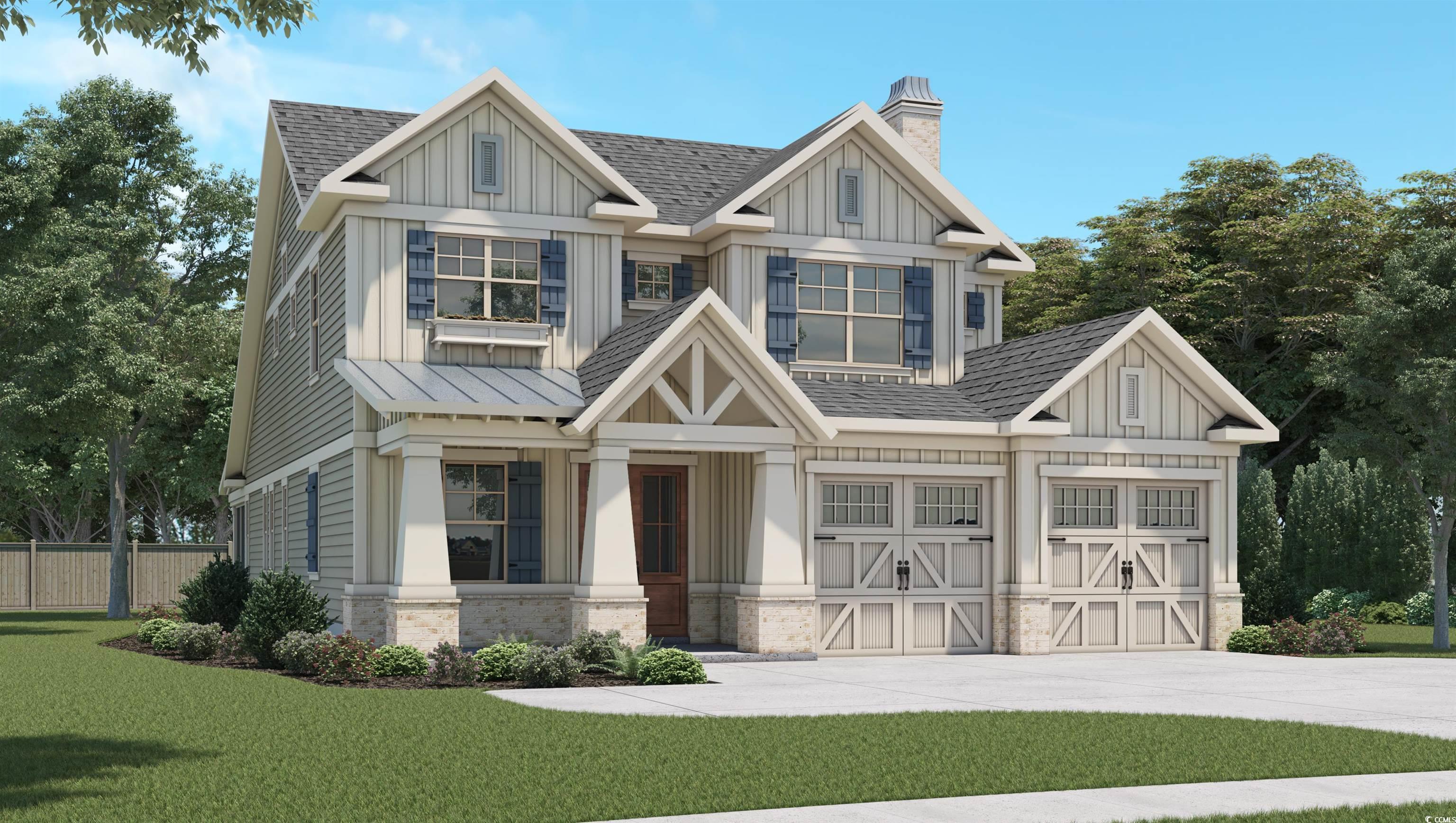 Craftsman inspired home with a front lawn and a ga