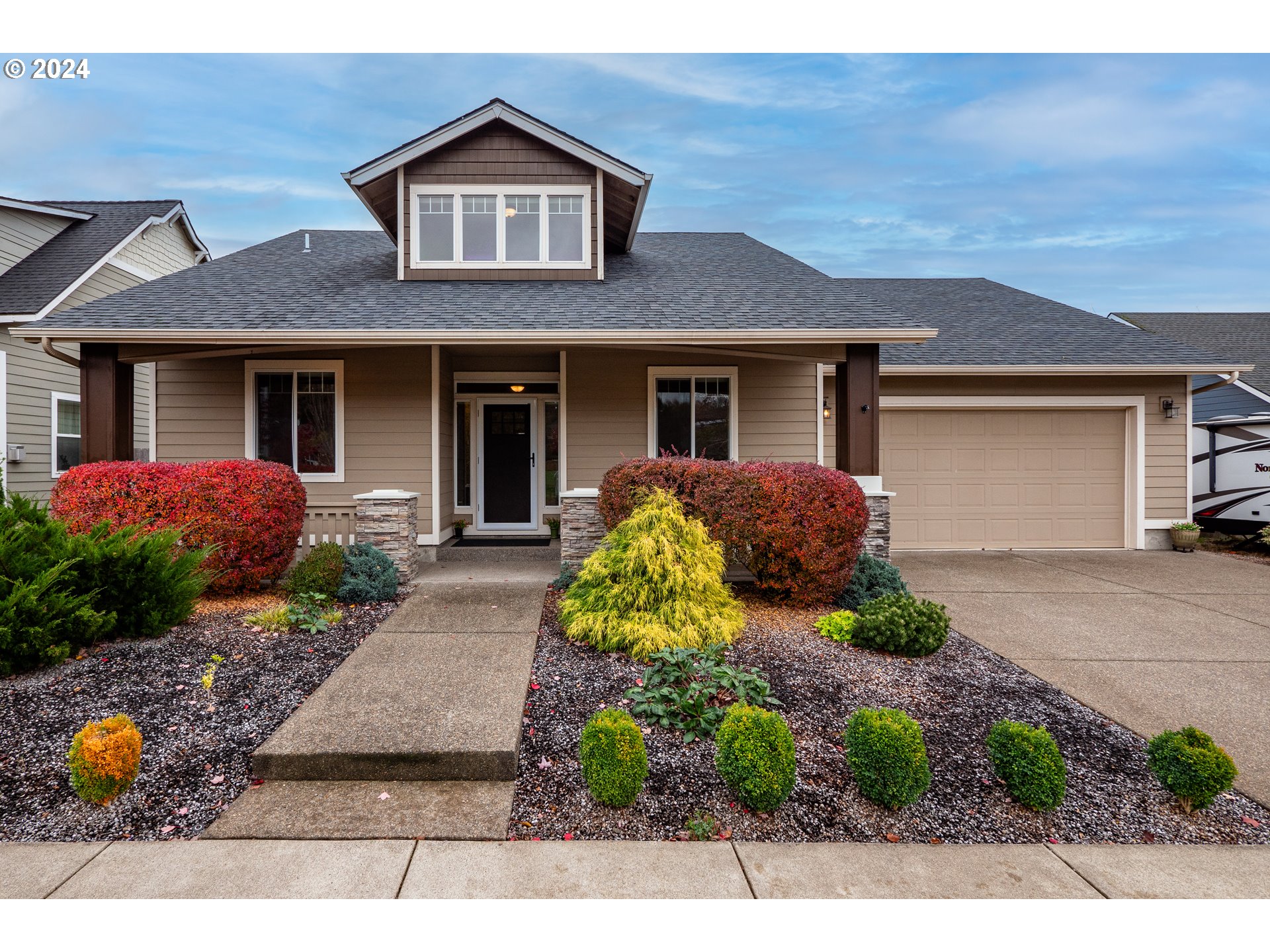 a front view of a house with garden