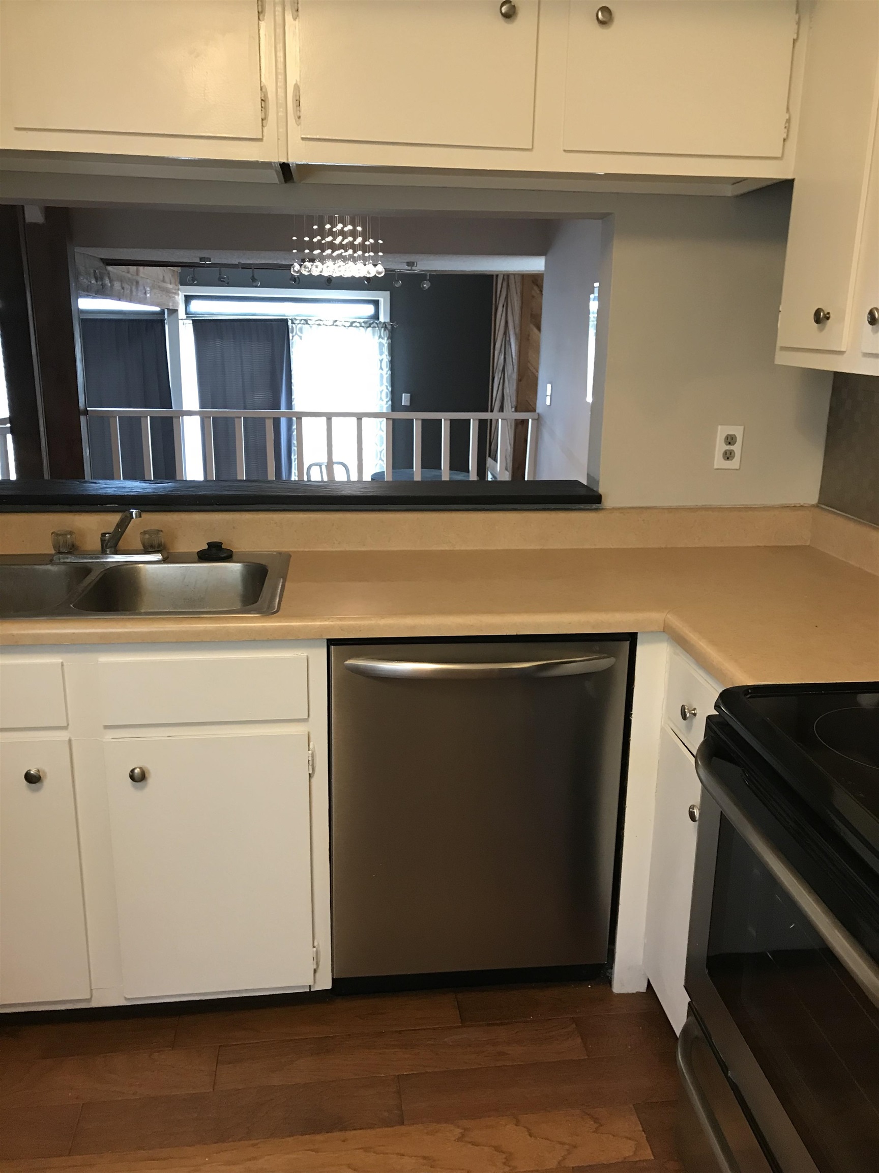 a kitchen with a stove and a microwave