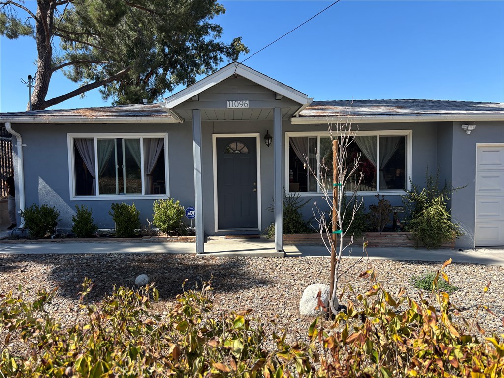 front view of a house with a small yard