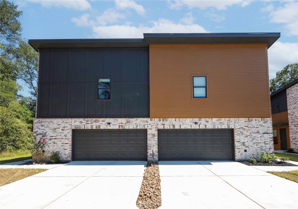 a front view of a house with garage