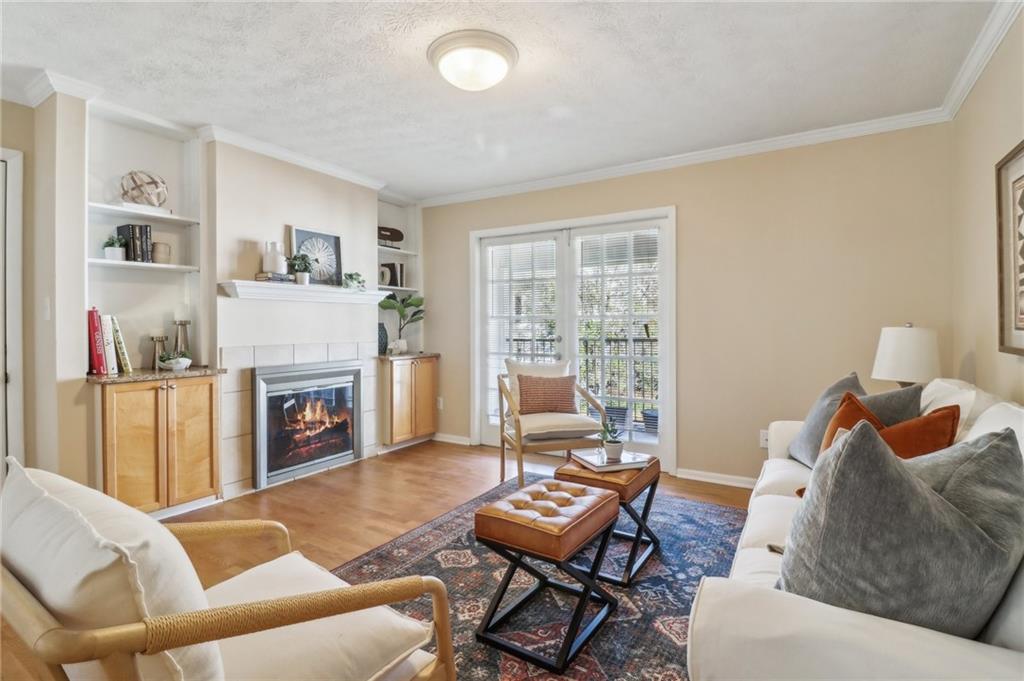 a living room with furniture and a fireplace