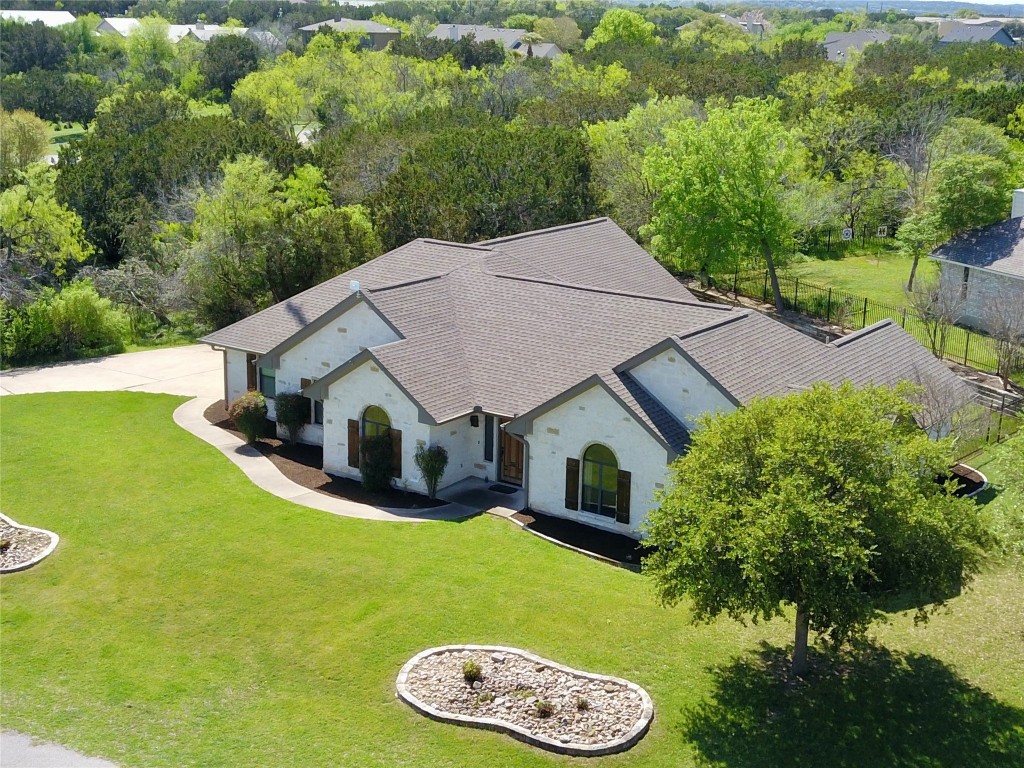 a view of a house with a backyard