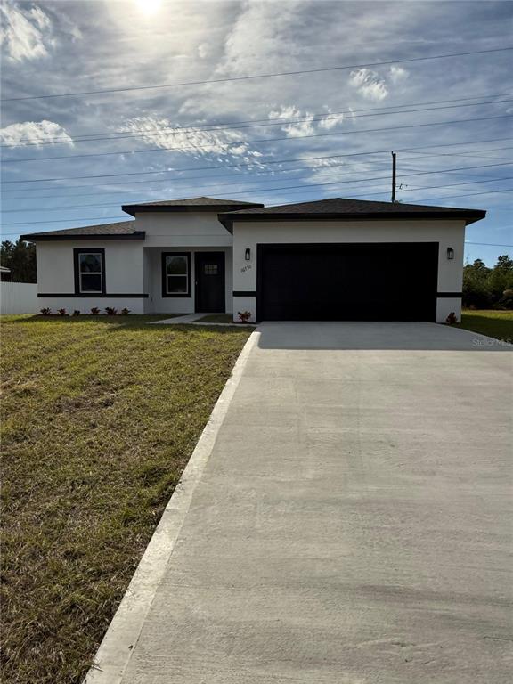 a front view of a house with yard