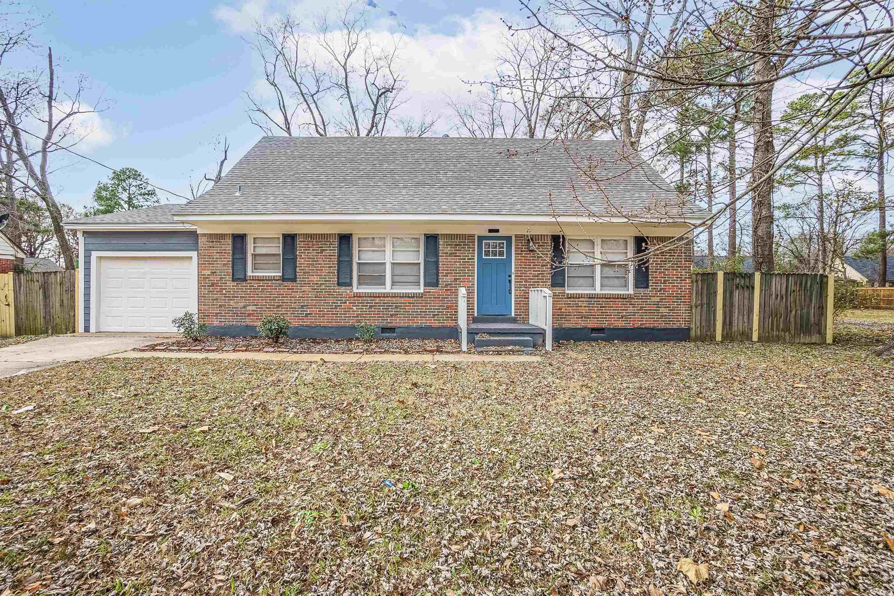 front view of a house with a yard