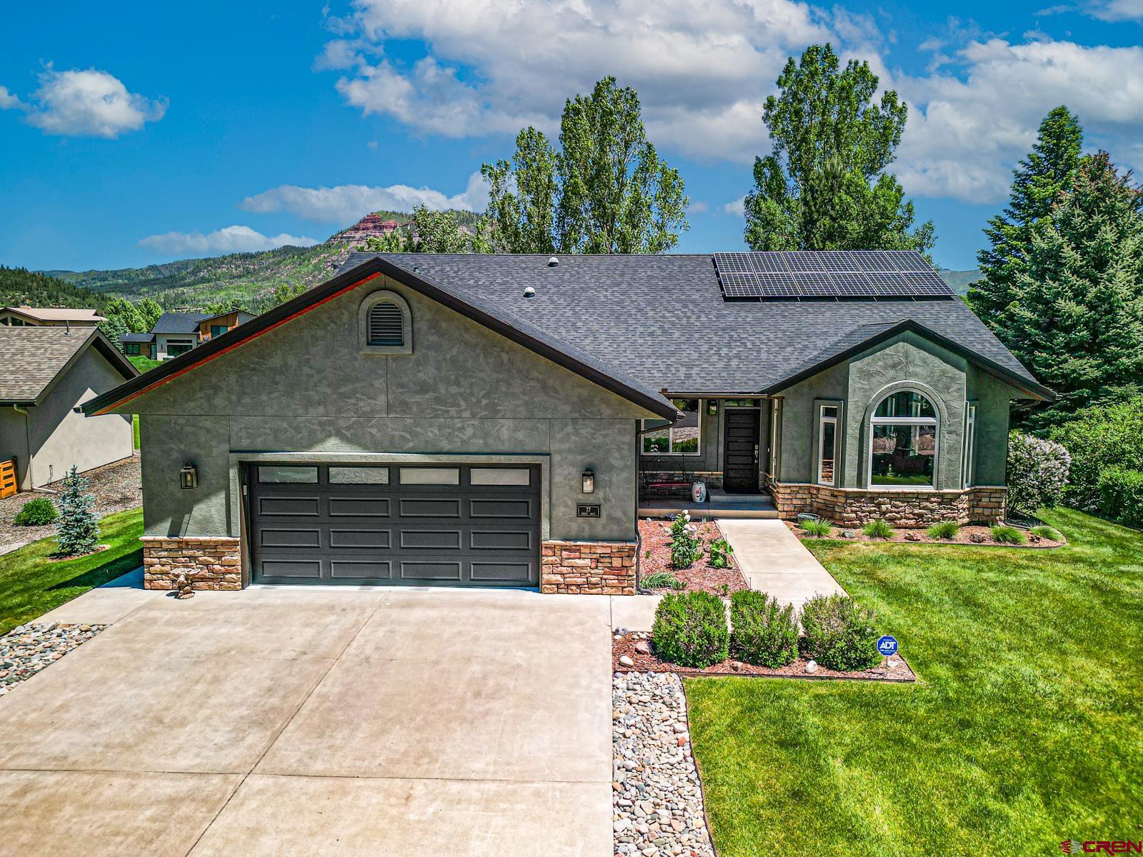 a front view of house with yard outdoor seating and barbeque oven