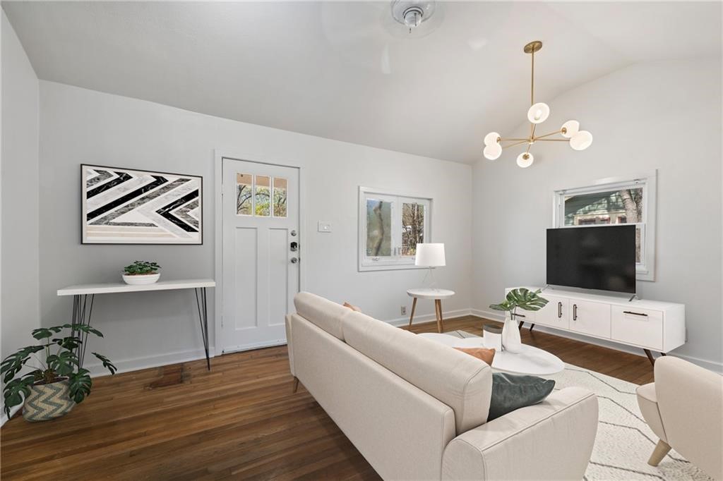 a living room with furniture and a flat screen tv