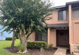 a house with a tree in front of it