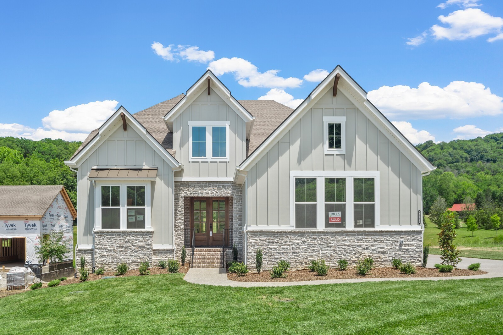 a front view of a house with a yard