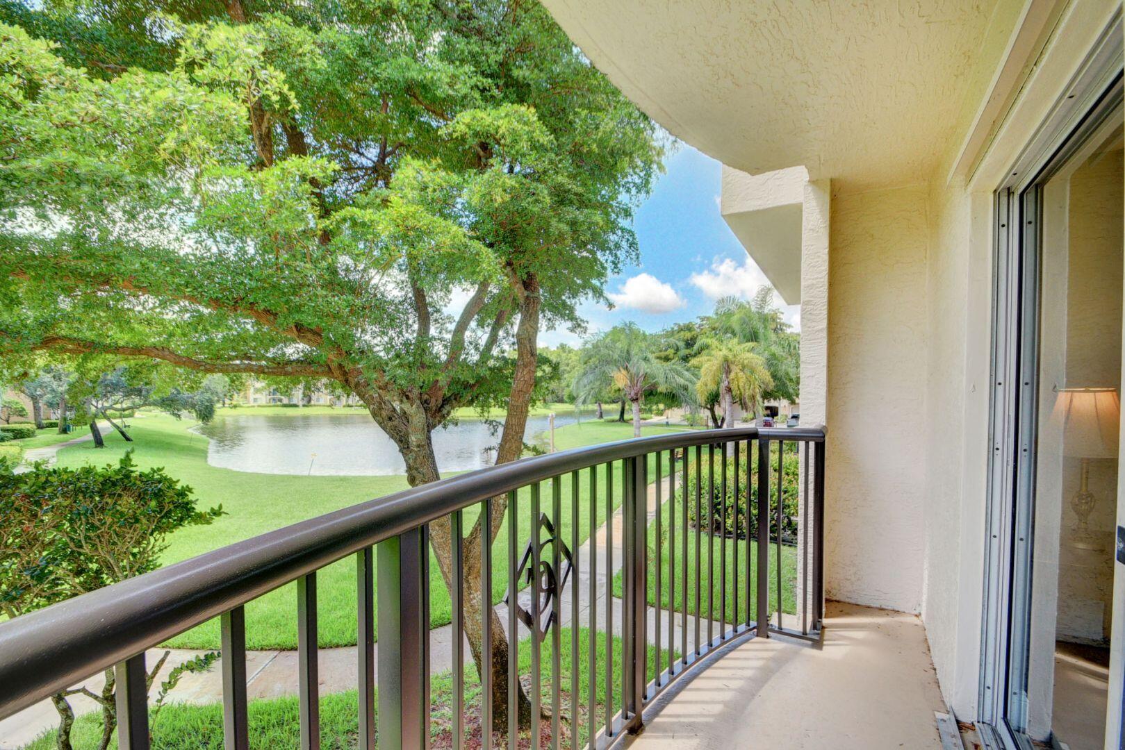 a view of a balcony with a tree