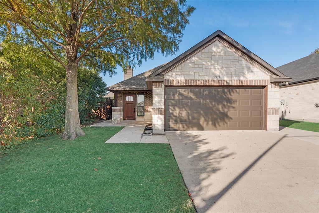 front view of a house with a yard