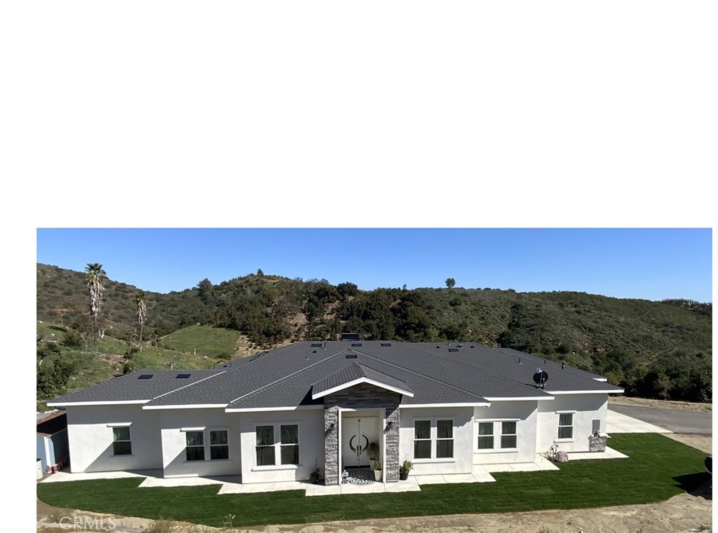 a view of house with mountain view