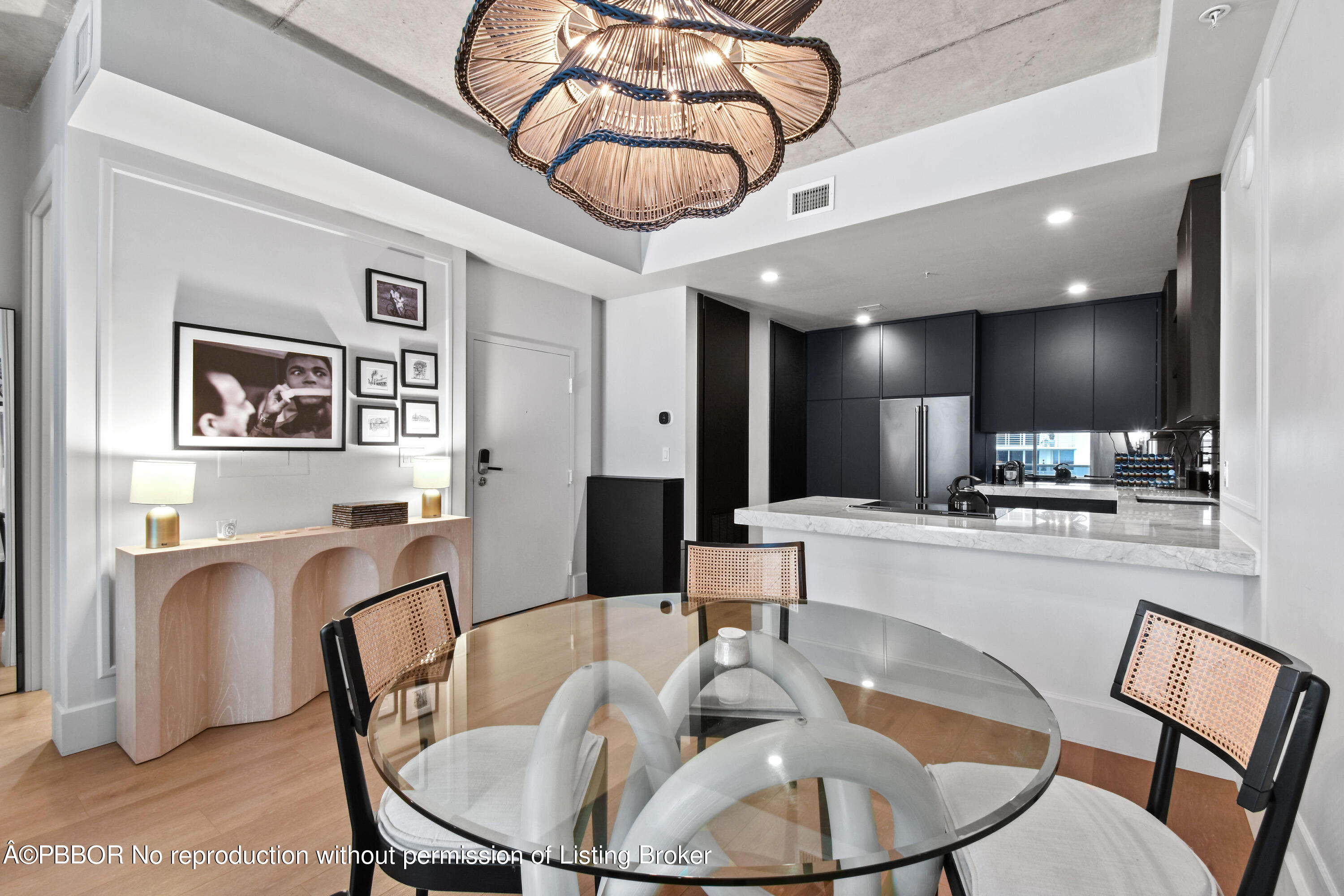 a large kitchen with a table and chairs