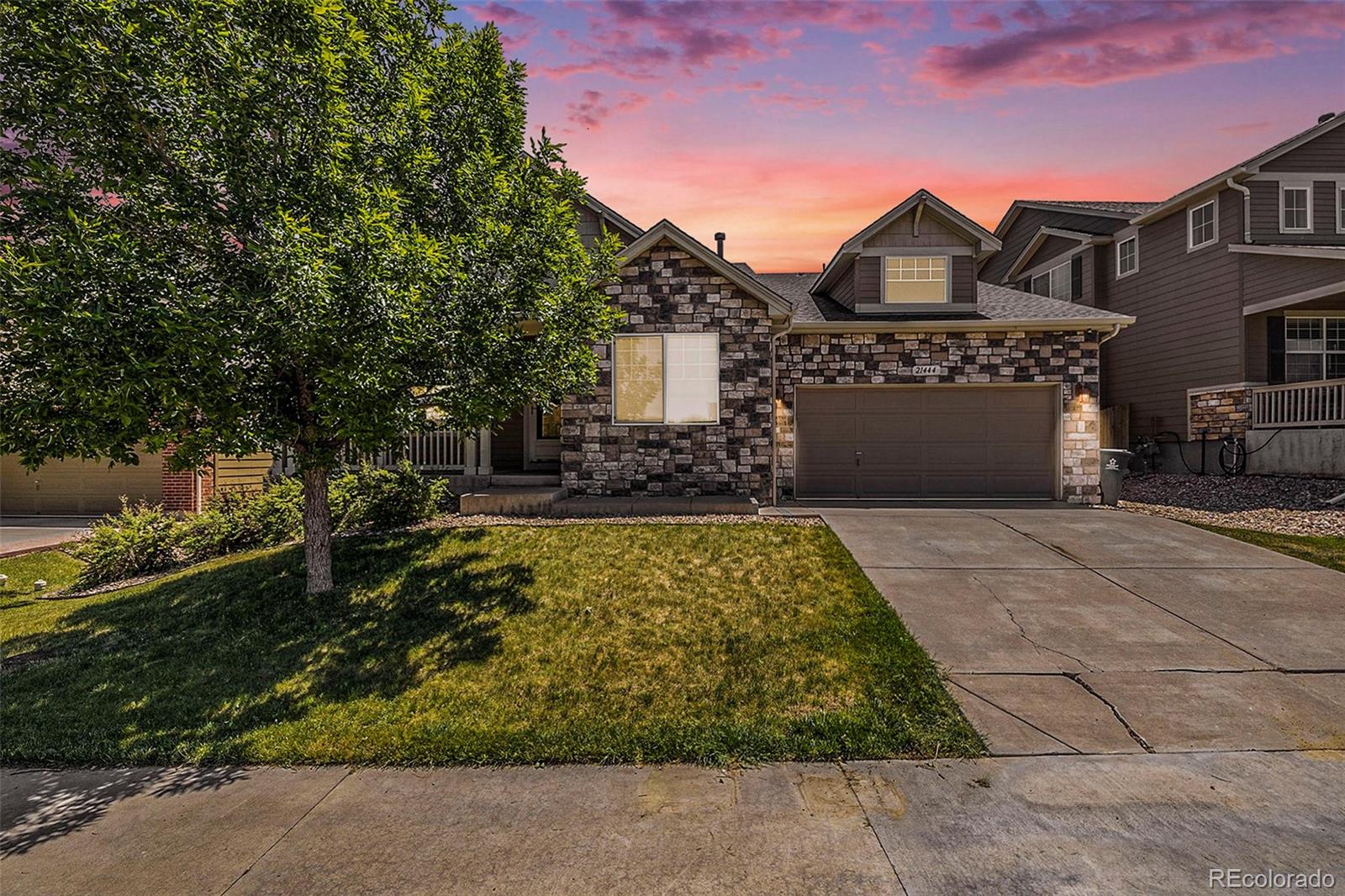 a front view of a house with a yard