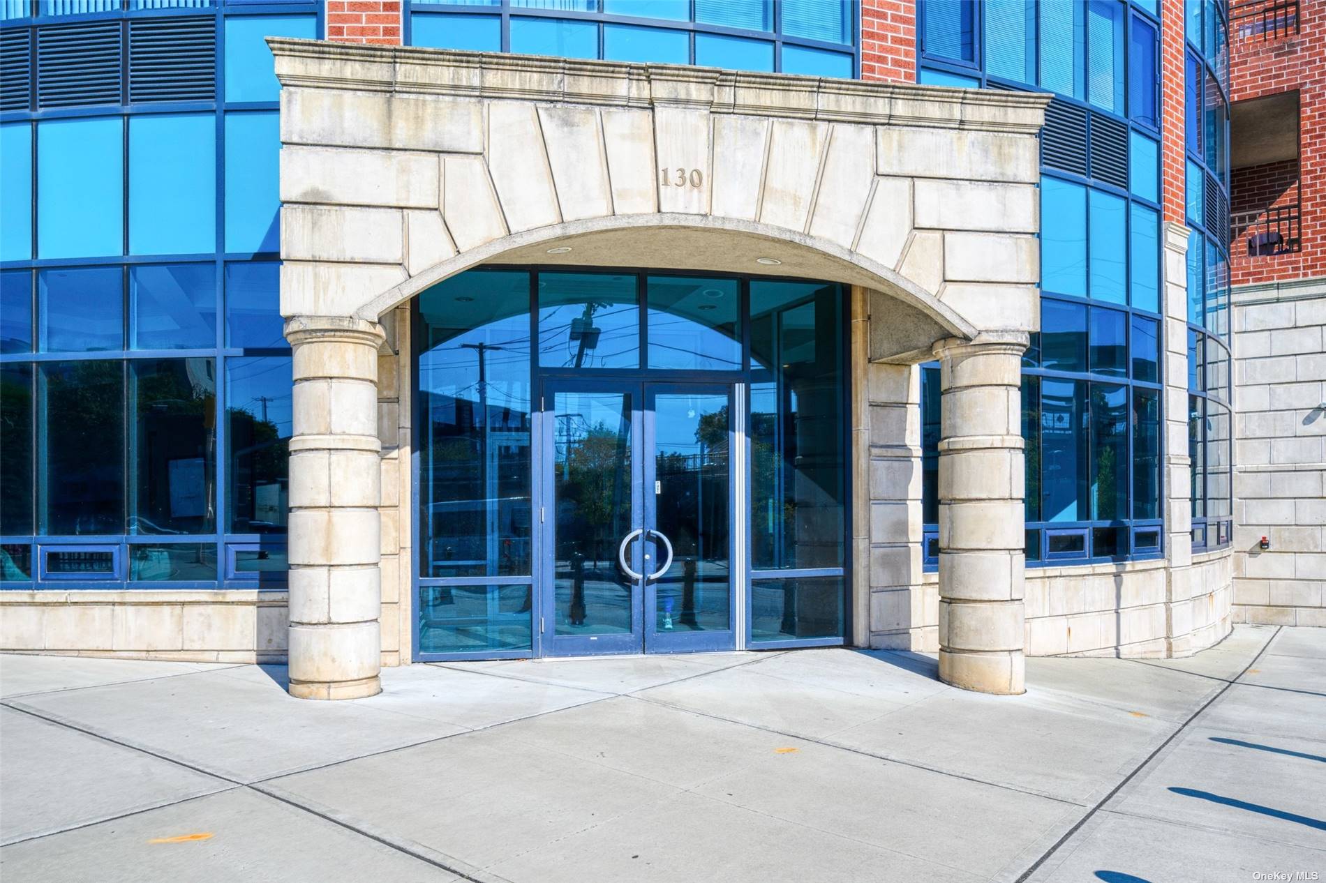 a view of entrance with a building and a window