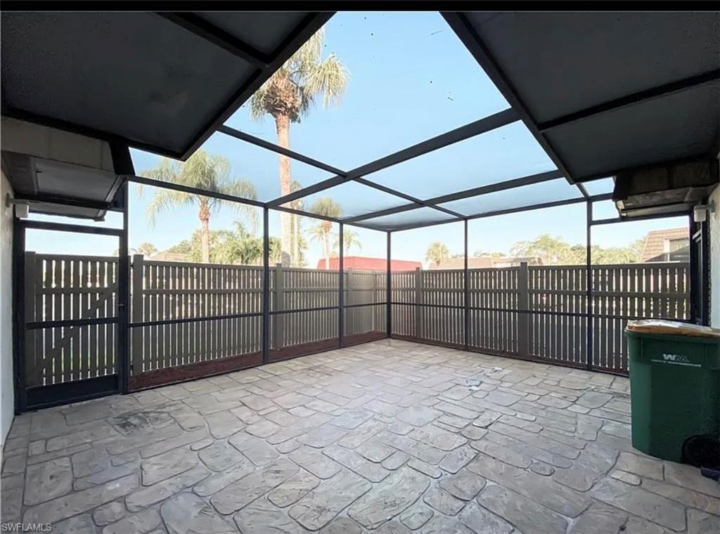 a view of outdoor space with wooden fence