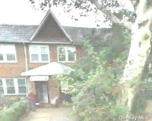 a aerial view of a house with a yard