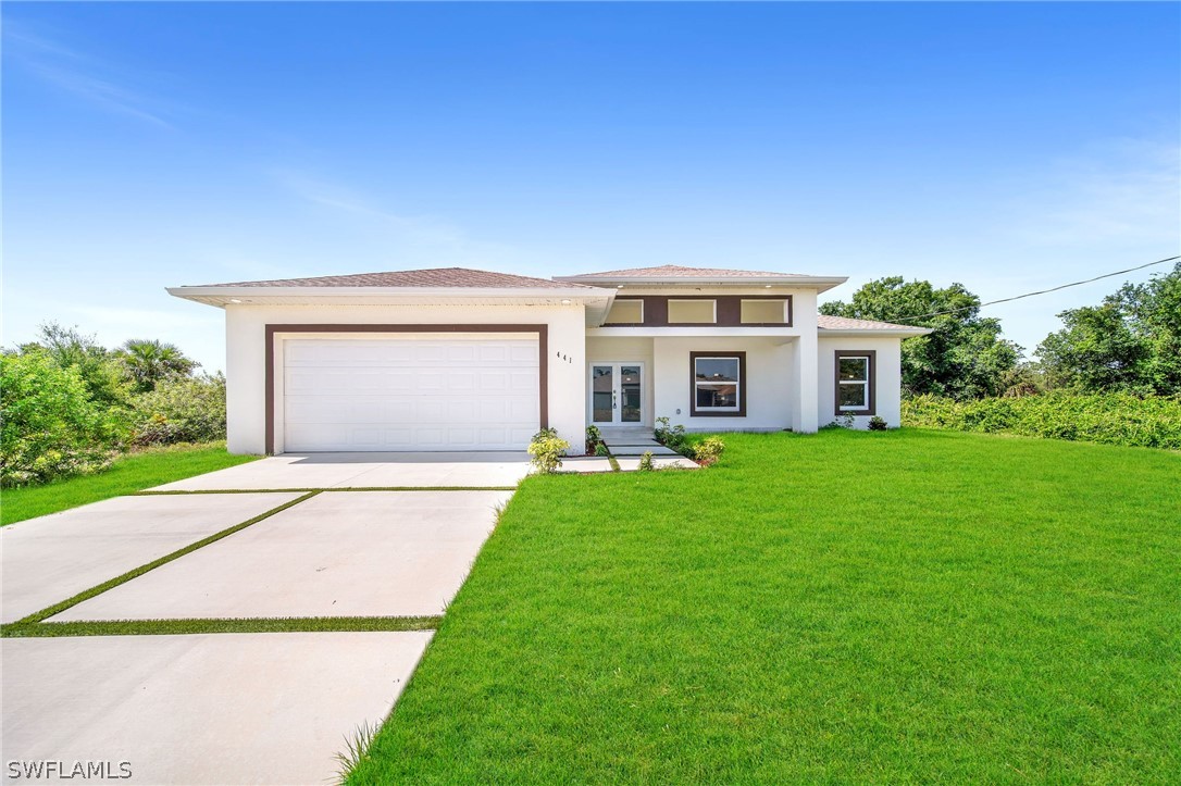 a front view of a house with a yard