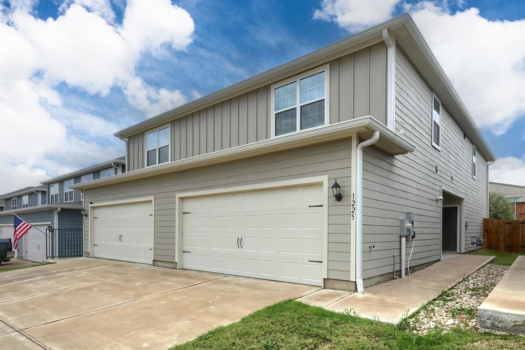 a front view of a house with a garage