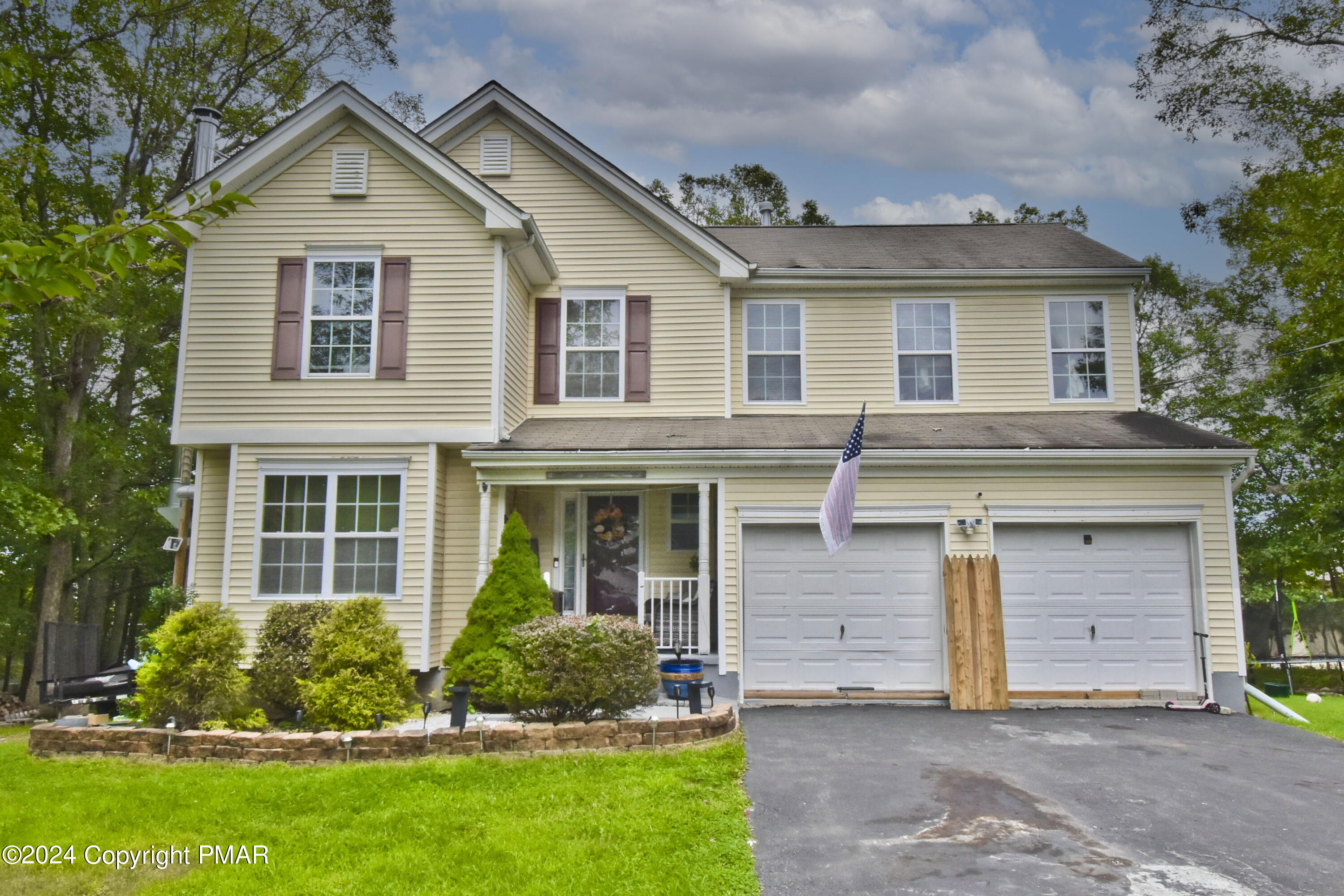 front view of a house with a yard