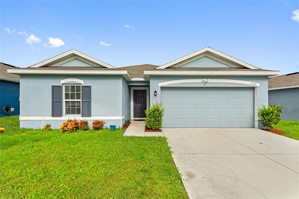 a front view of house with yard