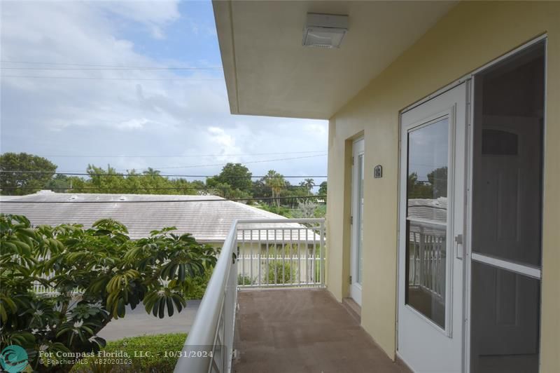 a view of a balcony with lake view