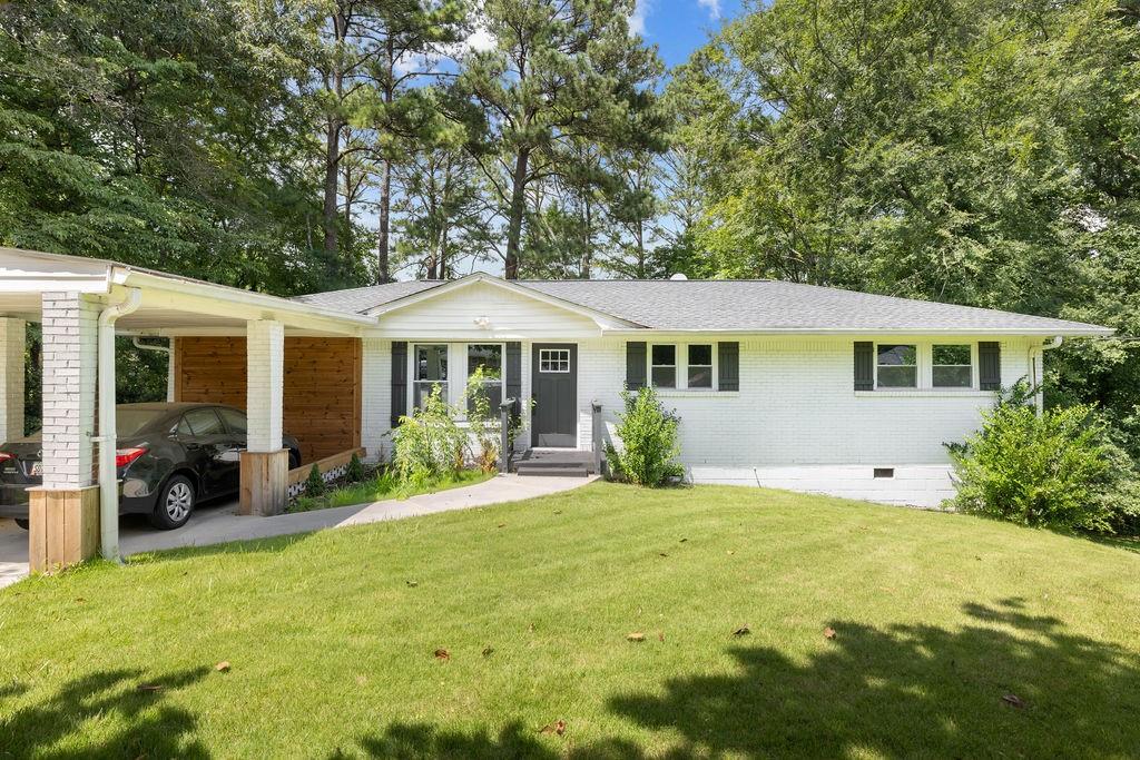 a front view of a house with a garden and porch