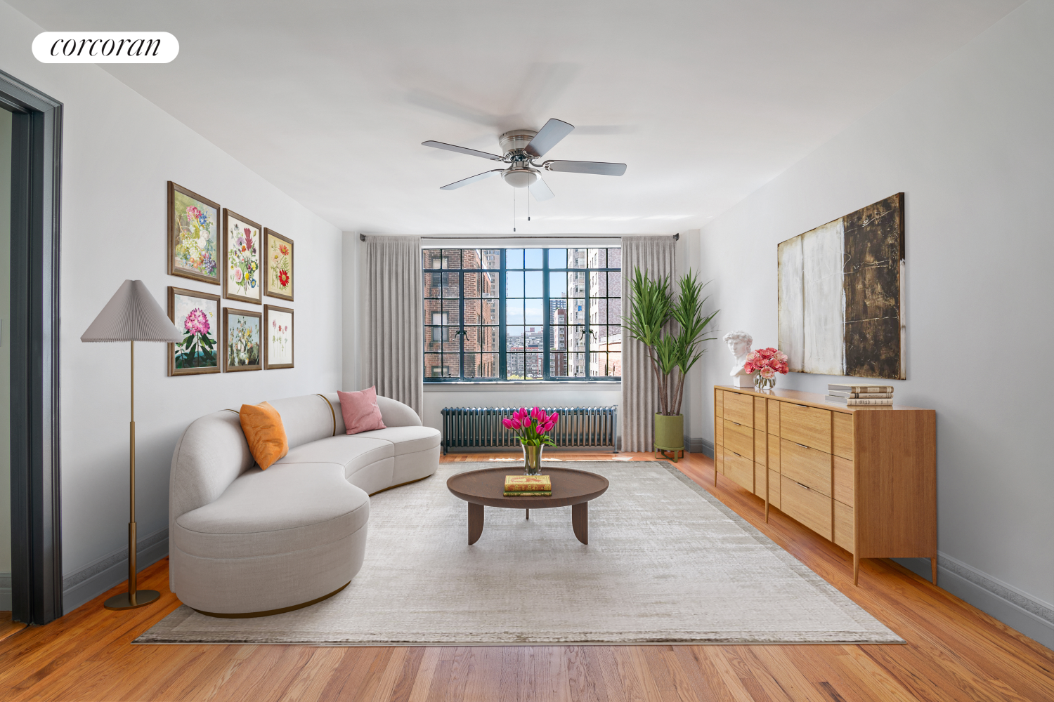 a living room with furniture a flat screen tv and a table