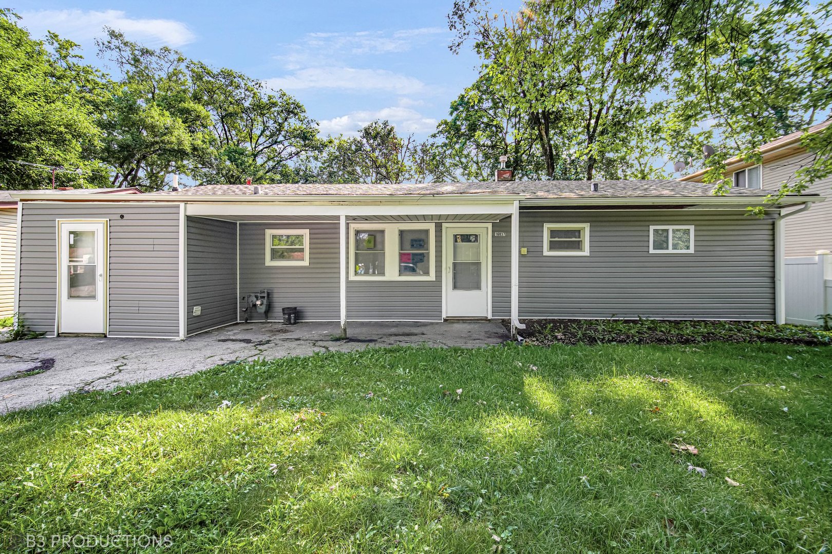 front view of a house with a yard