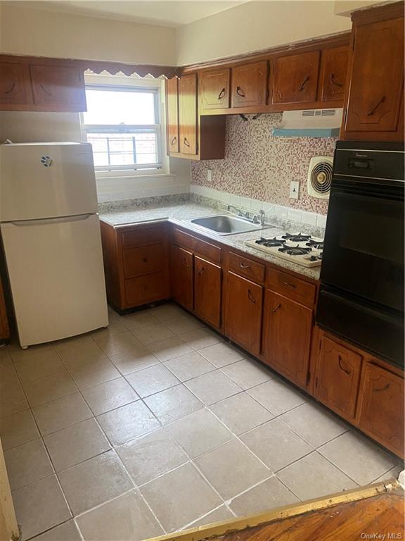 a kitchen with a cabinets and appliances