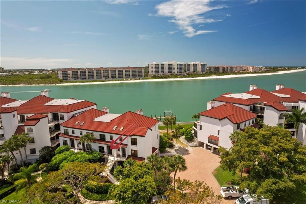 an aerial view of a house with a lake view