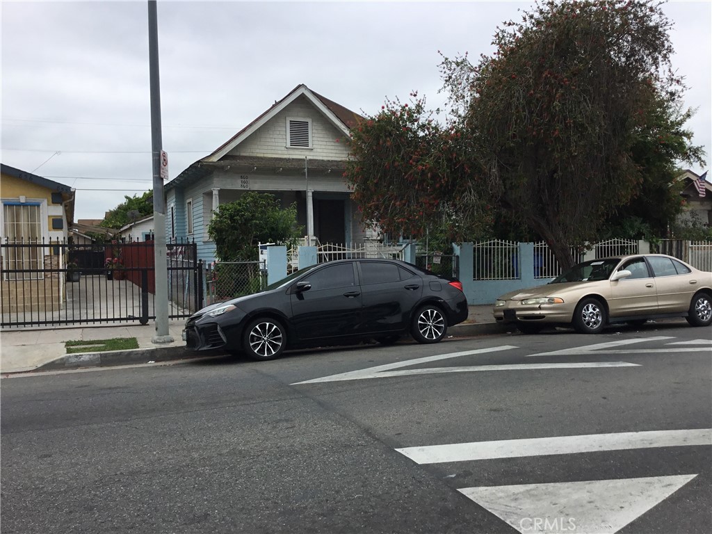 a view of a car parked in front of a house