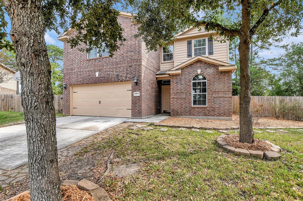 Front of this Brick and cement board home