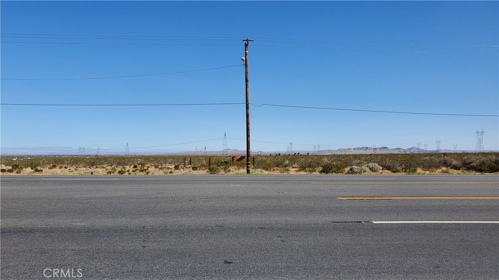 a view of a road with a building in the background