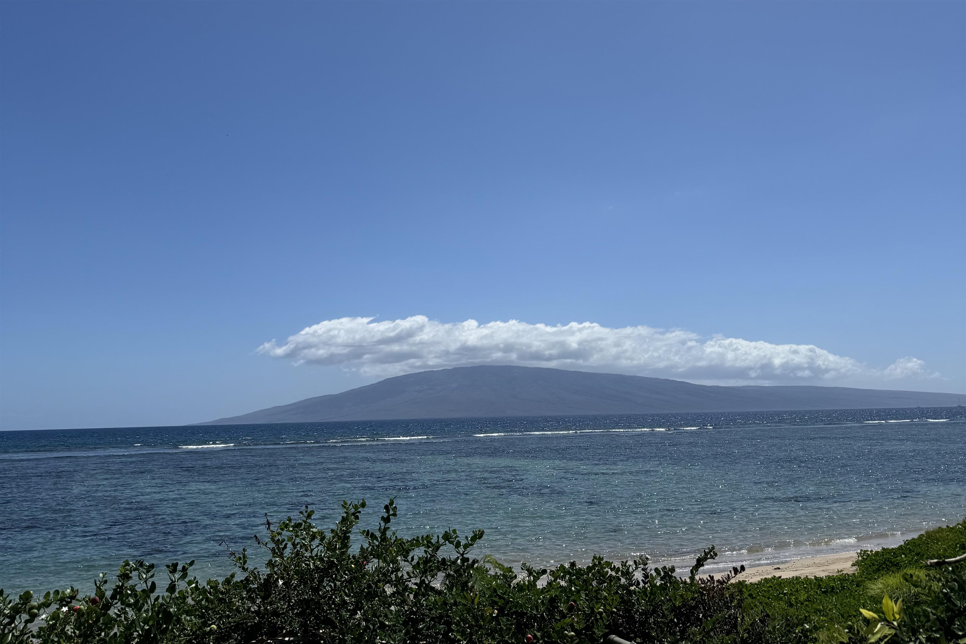 a view of an ocean and mountain