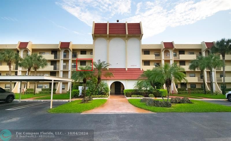 a front view of a building with garden