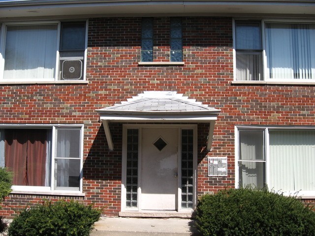 a front view of a house with a garage