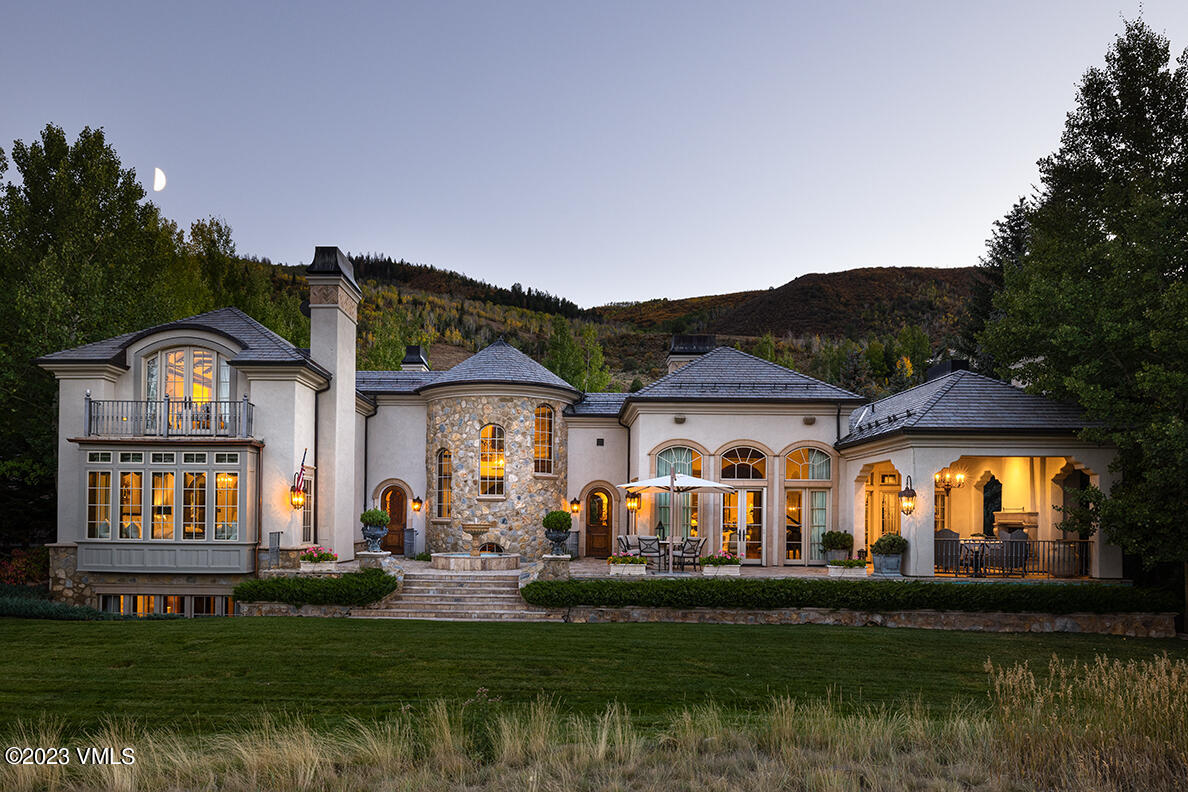 a front view of house and yard with green space