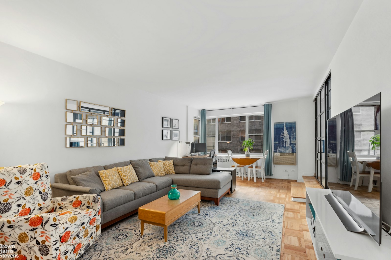 a living room with furniture and a large window