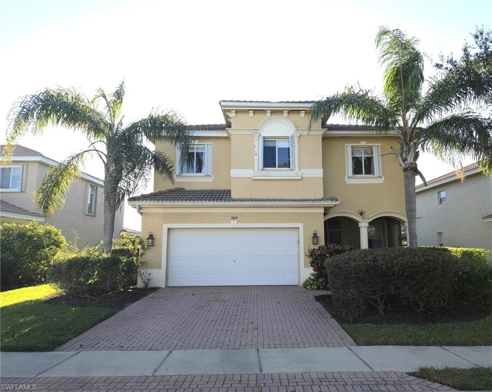 View of front facade featuring a garage