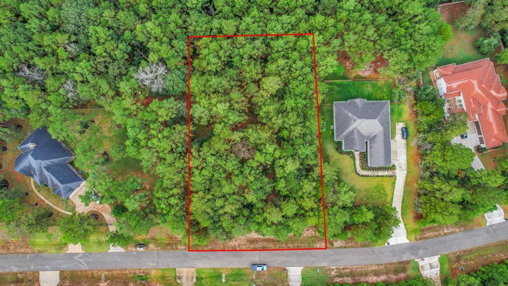 an aerial view of a house with a yard basket ball court and outdoor seating