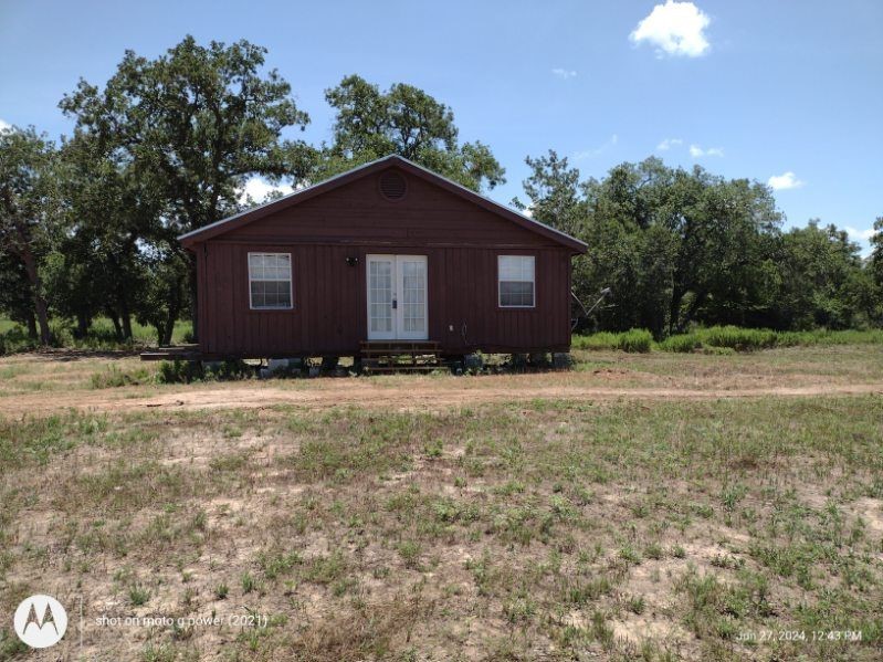 Cabin with electric, well, and septic.