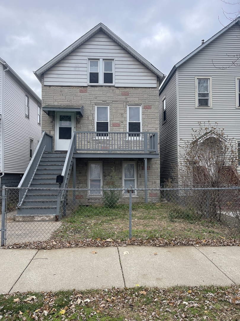 a front view of a house with garage