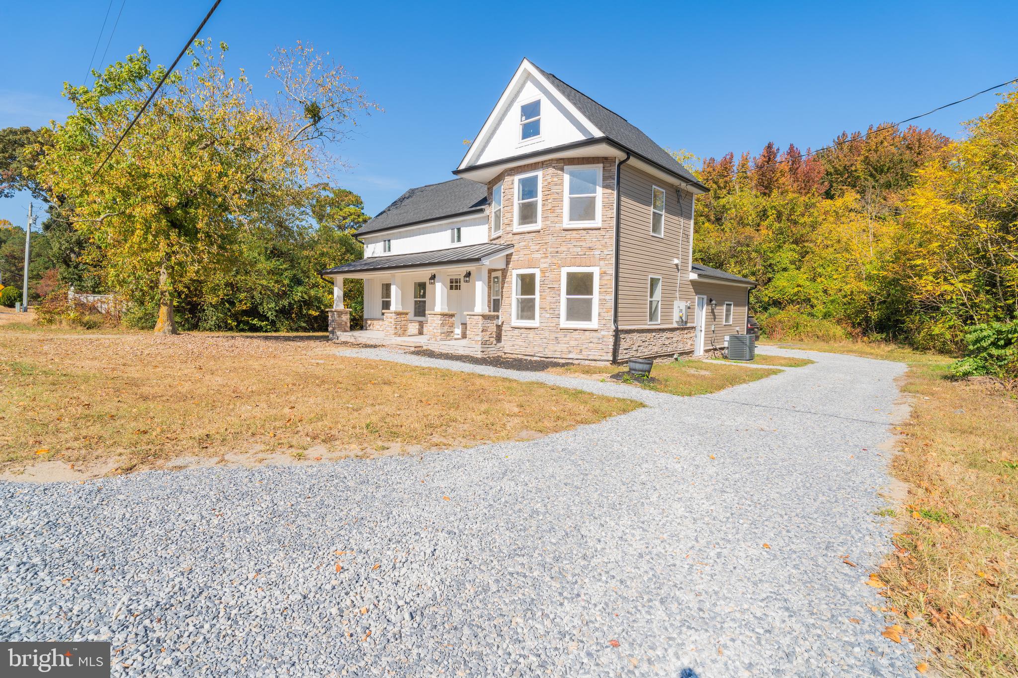 a view of house with yard and swimming pool