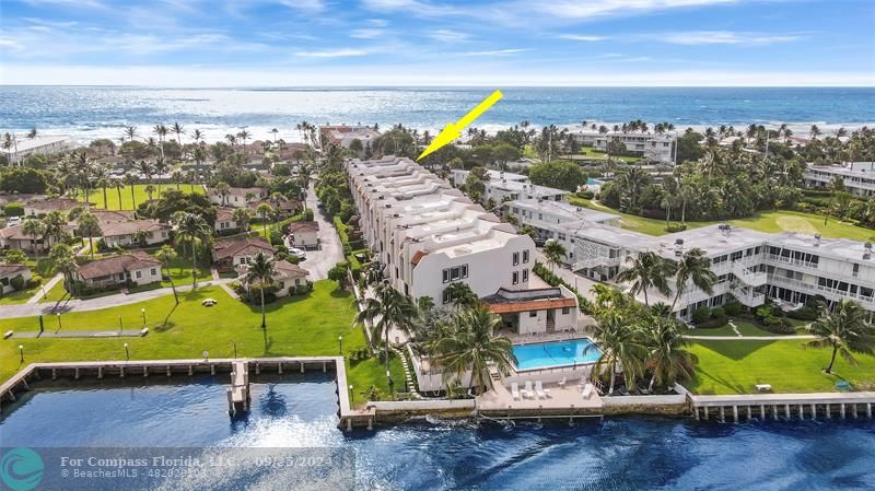 an aerial view of a house with a ocean view