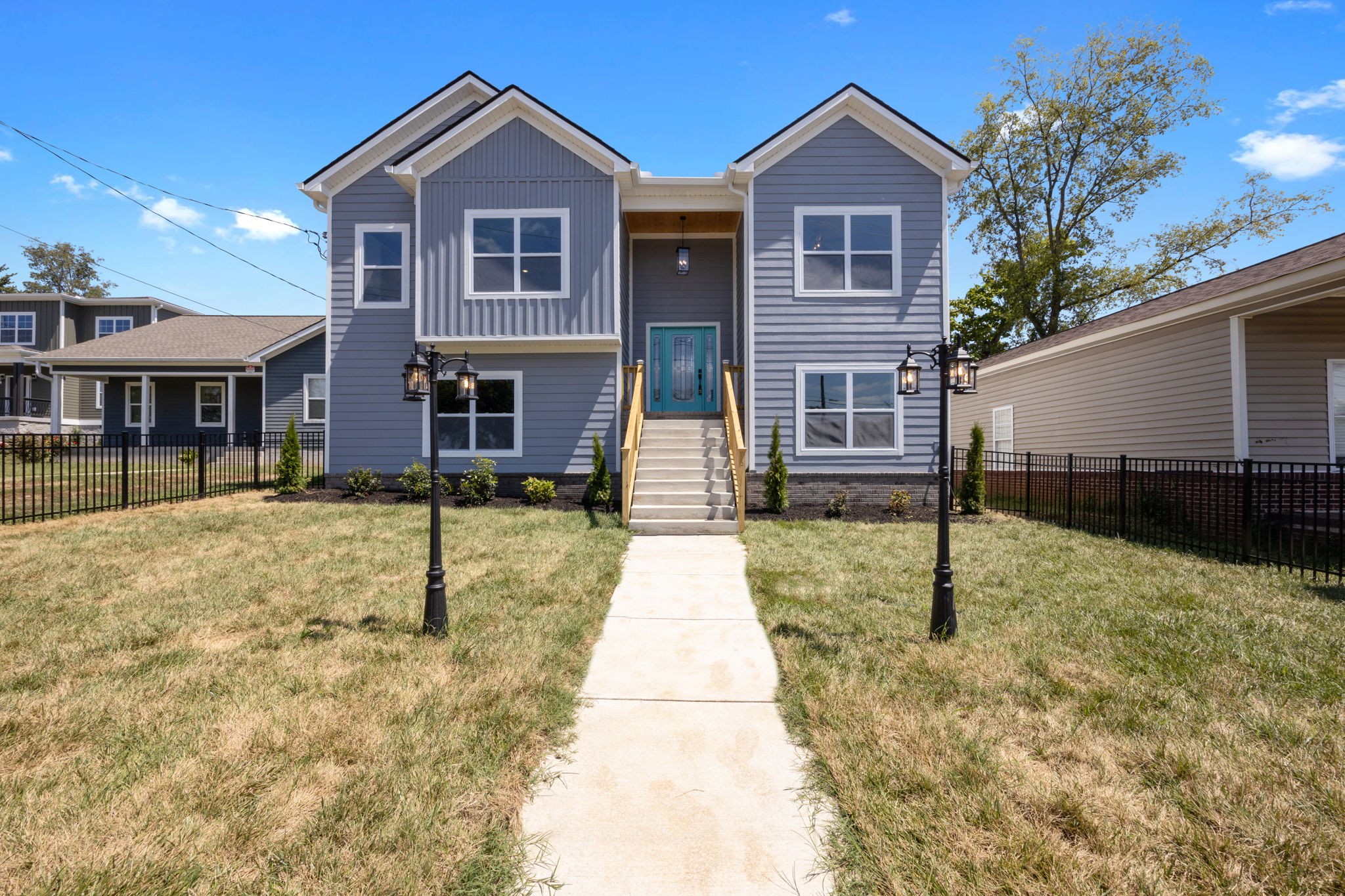 a front view of a house with a yard