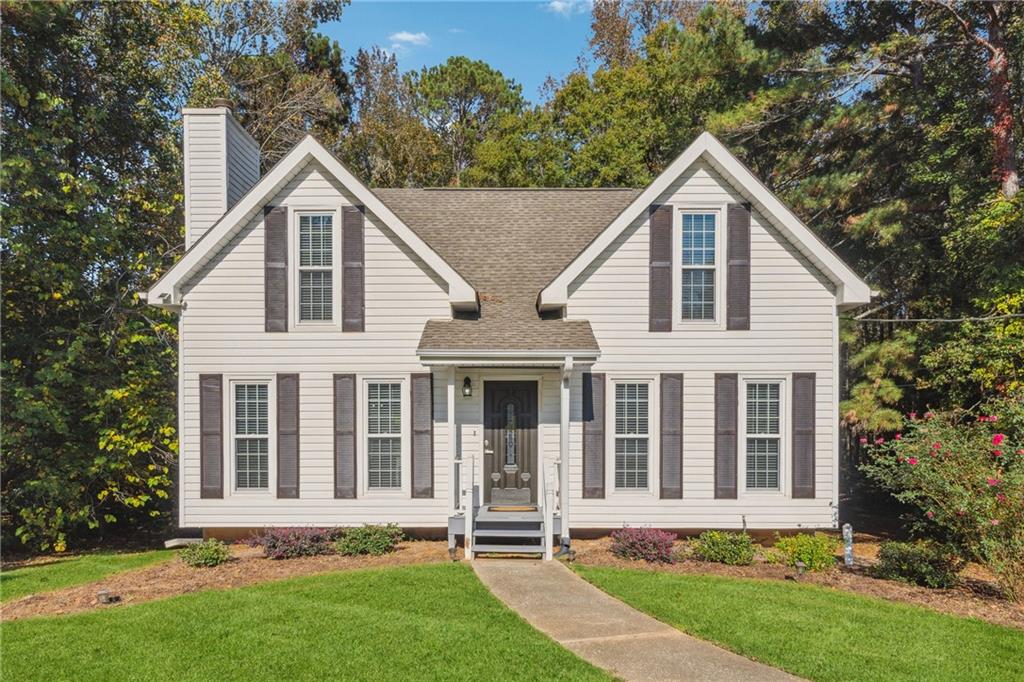 front view of a house with a yard