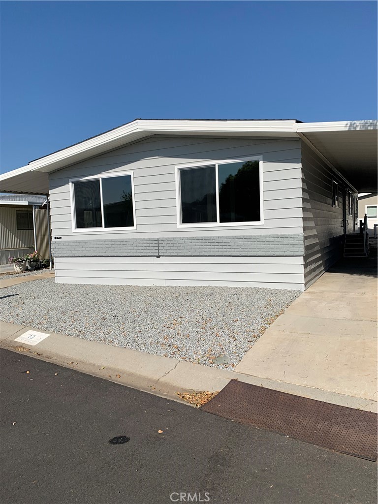 a view of house with yard